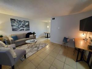 a living room with a couch and a table at Condo Near Downtown Austin - 2br in Austin