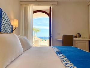 Cama ou camas em um quarto em Hotel Il Gabbiano