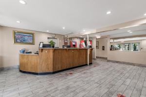 a lobby of a hospital with a reception desk at Sutter Inn in Yuba City