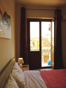 Ένα ή περισσότερα κρεβάτια σε δωμάτιο στο Casa Bacchilide