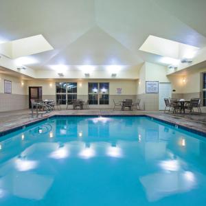 a large pool with blue water in a hotel at Staybridge Suites Fairfield Napa Valley Area, an IHG Hotel in Fairfield
