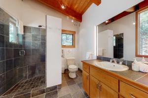 a bathroom with a sink and a shower and a toilet at Black Butte Ranch: Aspen Grove Retreat in Sisters +45 photos