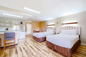 Ένα ή περισσότερα κρεβάτια σε δωμάτιο στο Baneberry Inn 5