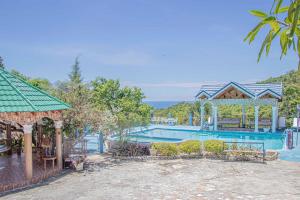 a resort with a swimming pool and a gazebo at Kassion Corner in Whitehouse