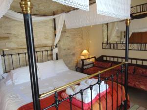 Ένα ή περισσότερα κρεβάτια σε δωμάτιο στο Charalambos Holiday Cottage