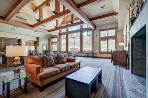 a living room with a couch and a table at One Ski Hill, A RockResort in Breckenridge