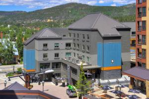 an aerial view of a building with a mountain in the background at Gravity Haus in Breckenridge