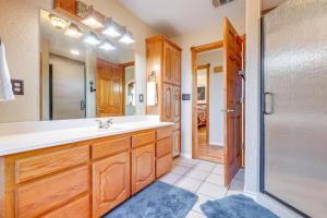 a bathroom with a sink and a shower at Pet-Friendly Canyon Lake Cabin, 1 Mi to Water! in Canyon Lake +36 photos