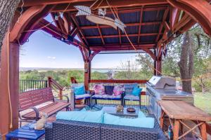 a wooden gazebo with a bench and a grill at Pet-Friendly Canyon Lake Cabin, 1 Mi to Water! in Canyon Lake