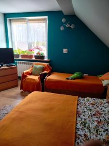 Łóżko lub łóżka w pokoju w obiekcie Zgorzanka