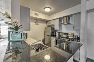 a kitchen with a sink and a counter top at Little Destin Beach! in Destin