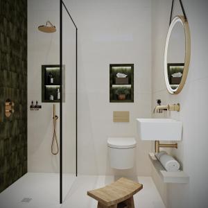 a bathroom with a toilet and a sink and a mirror at The Parr’s Bank Hotel in Warrington