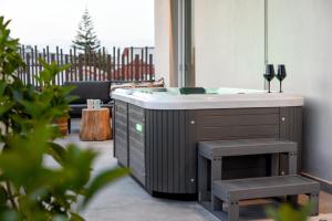 a bathroom with a sink and a mirror at Ambient Living Lofts in Preveza
