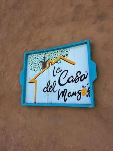 a sign for a la casa del mayo clinic at La Casa del Mango in Pampatar