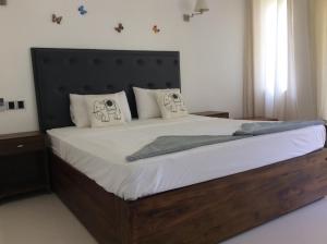 Postel nebo postele na pokoji v ubytování Lemazone Inn