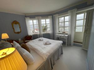 Postel nebo postele na pokoji v ubytování Badehotellet