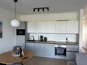 A kitchen or kitchenette at Apartment Rosarian