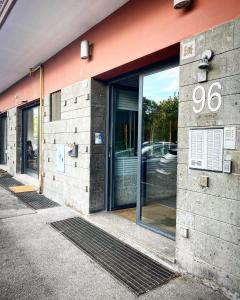 a facade of a building with a glass door at I-LARI Apartment in Rome