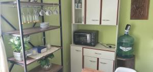 a kitchen with a microwave and a small microwave at Shabat in Ushuaia