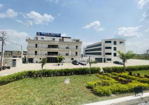 a building with a sign on the top of it at ONYX HOTEL Yamoussoukro in Yamoussoukro