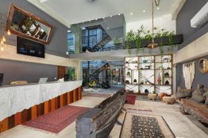 a lobby of a store with a bar at Hotel 52 Playa del Carmen in Playa del Carmen