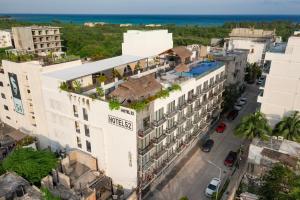 an aerial view of a building with the ocean in the background at Hotel 52 Playa del Carmen in Playa del Carmen