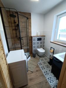 Ένα μπάνιο στο Zielona Ostoja - domy całoroczne z własną linią brzegową