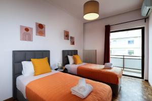 Ένα ή περισσότερα κρεβάτια σε δωμάτιο στο Central apt. with parking - 3 min from old port