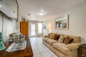 a living room with a couch and a table at Cozy and Convenient San Antonio Home 5 Mi to Dtwn! in San Antonio