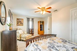 a bedroom with a bed and a ceiling fan at Cozy and Convenient San Antonio Home 5 Mi to Dtwn! in San Antonio