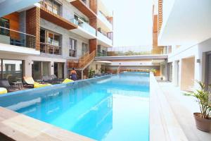 a large swimming pool in the middle of a building at Luxury Apartment at Corniche , Seaview Close Beach in Casablanca