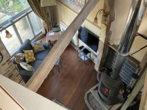 an overhead view of a living room with a fireplace at The Sawmill in Beaminster