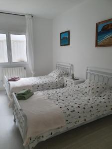 Postel nebo postele na pokoji v ubytování El piso de Valle-Inclán