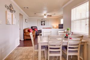 a dining room and living room with a table and chairs at Pet-Friendly Vacation Rental with Yard in Canyon in Canyon