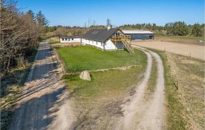 an aerial view of a house on a dirt road at Gorgeous Apartment In Pandrup With Kitchen in Pandrup