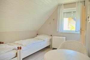 Postel nebo postele na pokoji v ubytování Haus Moin Moin