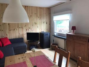 TV a/nebo společenská místnost v ubytování Le chalet du Parc un Retour aux sources