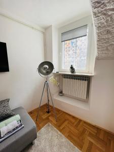 Телевизор и/или развлекательный центр в Downtown secret apartment