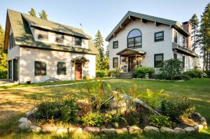 an old house with a garden in front of it at Waterfront Prospect Harbor Cottage Yard, Fire Pit in Prospect Harbor