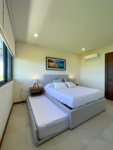 Cama o camas de una habitación en Ocean view 2BR Apartment Yum Balam