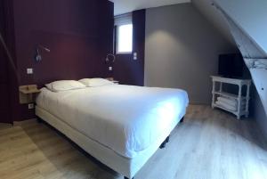 Hôtel Le Troubadour à Rocamadour客房内的一张或多张床位