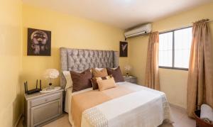 Postel nebo postele na pokoji v ubytování Acogedor Espacio en Santo Domingo Este.