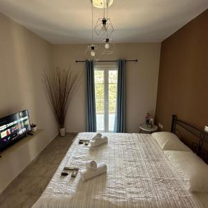 Postel nebo postele na pokoji v ubytování Assos BLUE house