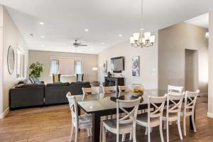 a dining room and living room with a table and chairs at Red Sand Hideaway #119 home in Santa Clara +52 photos