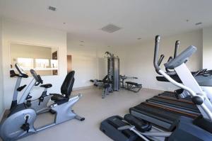 a gym with several cardio machines in a room at Hotel Via Premiere - Rio Centro in Rio de Janeiro