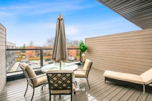 a patio with a table and chairs on a balcony at Brand new beautiful 3 beds 2 bathroom condo in Niagara Falls