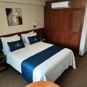 Postel nebo postele na pokoji v ubytování Hotel Carmel