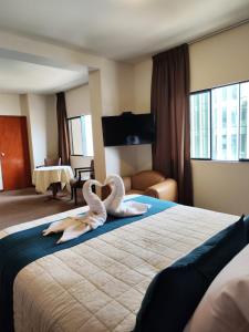 Postel nebo postele na pokoji v ubytování Hotel Carmel