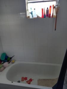 a bathroom with a bath tub with debris in it at Espacio de arte físico in Buenos Aires