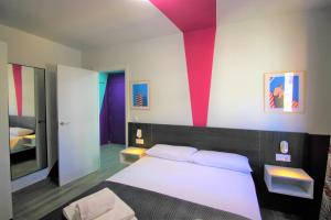 Posteľ alebo postele v izbe v ubytovaní CASATURIS NEWON APARTAMENTOS en EL CAMPELLO
